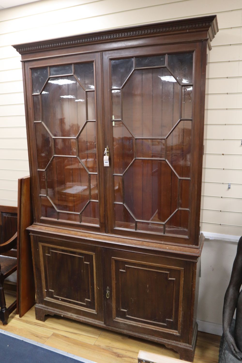 An Edwardian walnut bookcase, width 142cm height 225cm